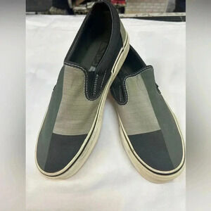 green and black VANS slip on